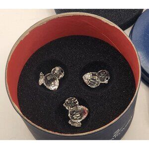 Swarovski crystal figurines of 3 baby chicks.
